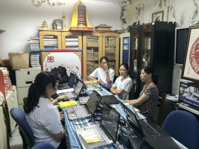 Professor Wu Ka-ming conducting interviews with students at a local NGO in Beijing