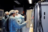 Prof. John Rudd (right) introduces the Animal Holding facilities to Prof. Shen Yan (left) and Prof. He Lin (middle)